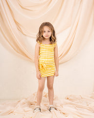 Girl checks flower skirt