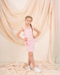 Girl checks flower skirt