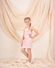 Girl checks flower skirt