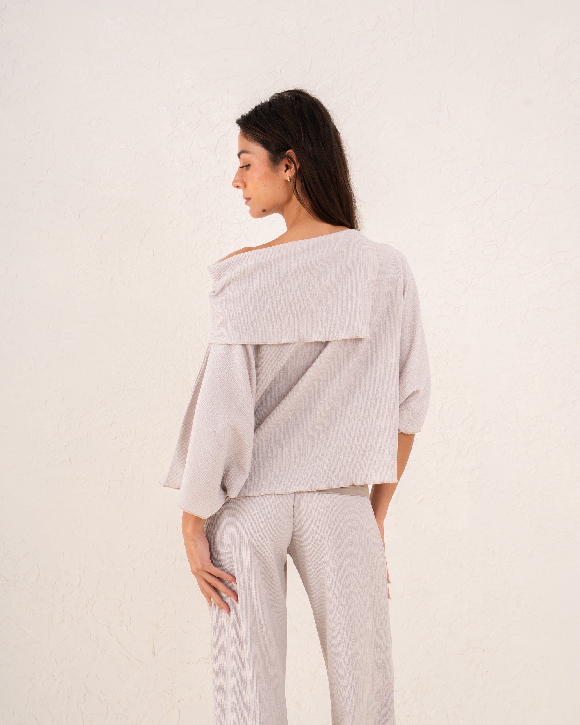 Women loose asymetric top