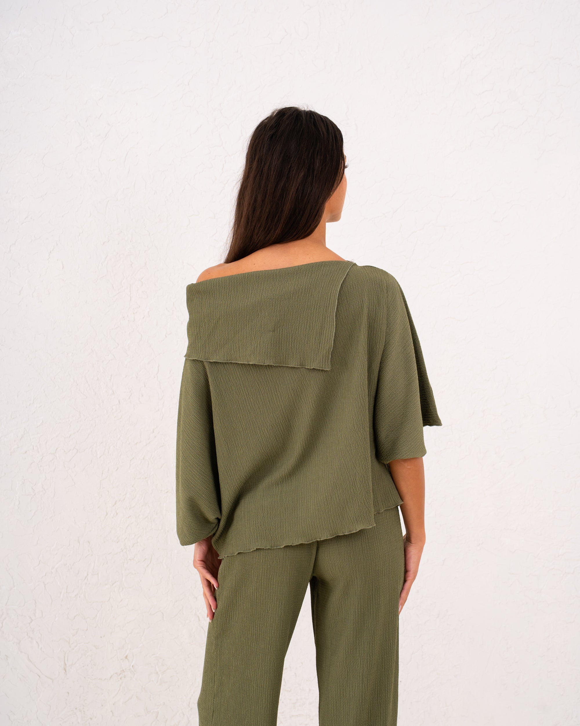 Women loose asymetric top