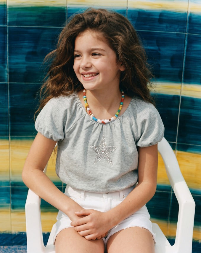 Girl puffball star top