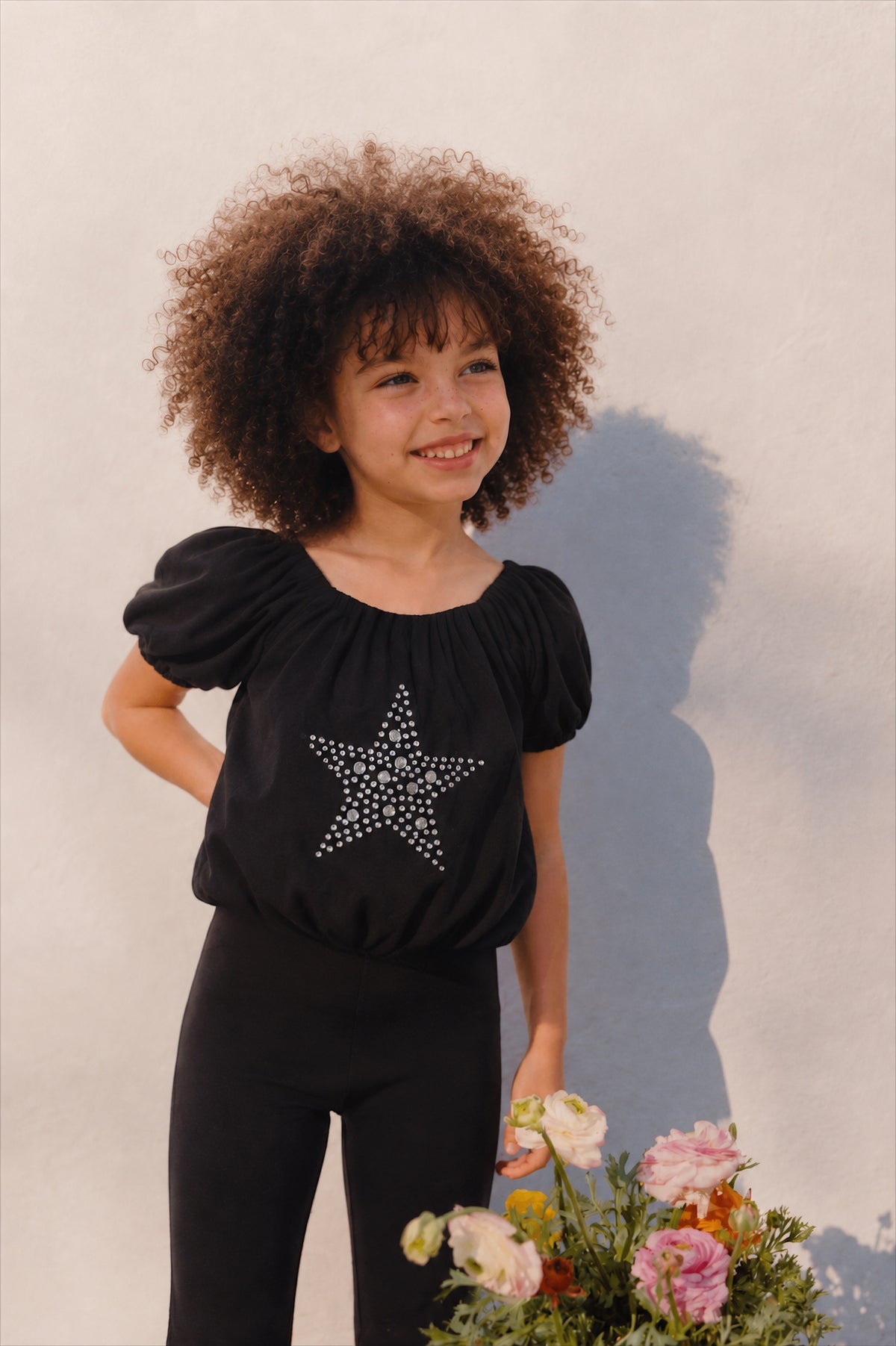 Girl puffball star top